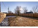 Large backyard with a wooden fence, offering lots of space for recreation and enjoyment at 1641 Iowa St, Indianapolis, IN 46203