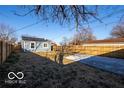 Spacious backyard surrounded by a wood fence, offering plenty of room for outdoor activities at 1641 Iowa St, Indianapolis, IN 46203