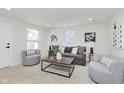 Bright living room with neutral tones, modern furniture, and ample natural light at 1906 N Park Ave, Indianapolis, IN 46202