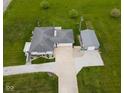Aerial view of a home with a long driveway and detached garage at 1970 E 1100 N, Alexandria, IN 46001