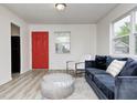 Cozy living room with modern furniture, including a plush blue sofa and sleek coffee table at 2021 Reformers Ave, Indianapolis, IN 46203