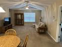 Inviting living room with ceiling fan, and comfortable seating, creating a cozy atmosphere at 2324 Harvest Moon Dr, Indianapolis, IN 46229