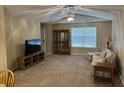 Inviting living room with ceiling fan, and comfortable seating, creating a cozy atmosphere at 2324 Harvest Moon Dr, Indianapolis, IN 46229