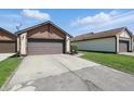 A nice house with a garage and a well-maintained driveway at 4107 Zinfandel Way, Indianapolis, IN 46254