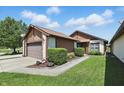Charming home featuring a two-car garage and manicured landscaping, inviting curb appeal at 4107 Zinfandel Way, Indianapolis, IN 46254