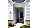 Inviting entryway featuring neutral colors, brick accents, and a covered porch at 4734 Cleome Dr, Plainfield, IN 46168
