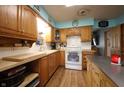 Kitchen featuring wood cabinets and white countertops at 5041 Norcroft Dr, Indianapolis, IN 46221