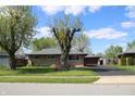 Charming single-story home featuring a well-manicured lawn and inviting curb appeal at 518 Cherry St, Beech Grove, IN 46107