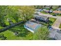Aerial view of backyard with shed, patio, and ample lawn space for outdoor enjoyment at 57 Hadley St, Mooresville, IN 46158
