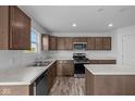 Bright kitchen with stainless steel appliances, center island, and sleek countertops at 7417 Waylon Way, Indianapolis, IN 46239
