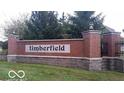 Timberfield community entrance signage with brick pillars and stone accents at 7522 Timberfield Ln, Indianapolis, IN 46259