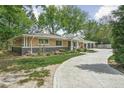 Charming home with landscaped yard, stone accents, and a spacious driveway at 846 W 56Th St, Indianapolis, IN 46228