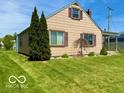 Inviting single-Gathering home boasting a well-manicured lawn and established landscaping at 908 E 32Nd St, Anderson, IN 46016