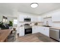 Well-equipped kitchen featuring white cabinets, stainless steel appliances, and a wood countertop at 10132 E 33Rd St, Indianapolis, IN 46235