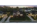 Beautiful home in a quiet neighborhood, with a well-maintained yard and mature trees surrounding the property at 10599 Geist View Dr, Fishers, IN 46055