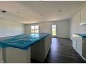 Spacious kitchen featuring an island, recessed lights and durable floors at 1216 Mcbride St, Greenfield, IN 46140