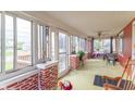 Bright sunroom with many windows, a ceiling fan, and space for seating and dining at 1633 E Thompson Rd, Indianapolis, IN 46227