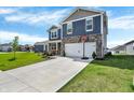 Inviting two-story home with a spacious driveway leading to a two-car garage, perfect for Gathering living at 2972 W Patchwork Dr, Monrovia, IN 46157