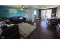 Spacious living room showcasing hardwood floors, a cozy couch, and modern finishes at 5218 Fletcher St, Anderson, IN 46013