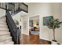 Spacious entryway features a staircase, hardwood floors and access to multiple rooms at 5255 Apache Moon, Carmel, IN 46033