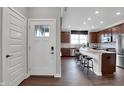 Charming entryway view leading into kitchen with stainless steel appliances and countertop seating at 5291 Nettleton Way, Avon, IN 46123