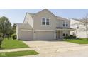 Charming two-story home featuring a two-car garage and well-maintained front lawn at 5646 Skipping Stone Dr, Indianapolis, IN 46237