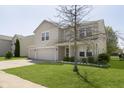 Charming two-story home featuring a two-car garage and well-maintained front lawn at 5646 Skipping Stone Dr, Indianapolis, IN 46237