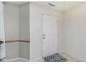 Bright foyer with a white front door, neutral walls, and a patterned welcome mat at 5646 Skipping Stone Dr, Indianapolis, IN 46237