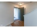 Inviting entryway with wood floors, open door, and view of the home's interior at 6516 Amherst Way, Zionsville, IN 46077