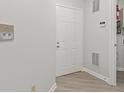 Bright entryway with a white door and light-colored flooring, showcasing a clean design at 8720 Yardley Ct # 100, Indianapolis, IN 46268