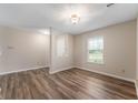 The bright living room features new flooring and ample natural light at 9454 W Canoe Trl, Pendleton, IN 46064