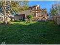Large backyard with wooden deck and pergola, perfect for outdoor entertaining and relaxation at 11620 E 75Th St, Indianapolis, IN 46236