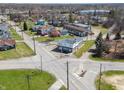 Aerial view of commercial building featuring ample parking, landscaping, and convenient street access at 1630 N Granville N Ave, Muncie, IN 47303