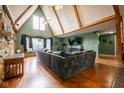 Spacious living room with high ceilings, a stone fireplace, and large windows for ample natural light at 171 Williams Trce, Plainfield, IN 46168