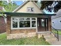 Charming bungalow featuring a brick foundation, and inviting front entrance at 2119 S Garfield Dr, Indianapolis, IN 46203