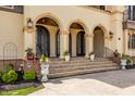 Stunning entryway with arched doorways and manicured landscaping at 2377 Finchley Rd, Carmel, IN 46032