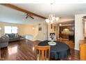 Open-concept living and dining area featuring hardwood floors, natural light, and a ceiling fan at 3131 Stillmeadow Dr, Indianapolis, IN 46214