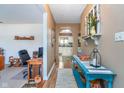 Inviting hallway showcasing decorative touches and an open view into the kitchen at 417 W Ash St, Jamestown, IN 46147