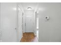 Bright entryway featuring tile flooring, neutral walls, and a full-view storm door at 5177 Fairway Dr, Avon, IN 46123
