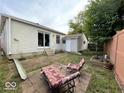 Backyard with small patio, shed, and outdoor seating area, perfect for small gatherings at 5450 E 18Th St, Indianapolis, IN 46218