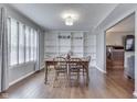 Inviting dining room featuring hardwood floors, a built-in bookshelf, and a classic wooden dining set at 5617 Gainesway Dr, Greenwood, IN 46142