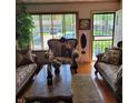 Cozy living room featuring plush seating, a stylish coffee table, and a view to the front yard at 8136 E 37Th Pl, Indianapolis, IN 46226