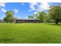 Charming single-story brick home with a spacious lawn and inviting curb appeal at 1171 S Daisy Ln, New Palestine, IN 46163