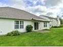 Spacious backyard with well-maintained lawn and a view of the home's exterior at 11821 Bills Ave, Fishers, IN 46037