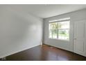 Simple bedroom with hardwood floors, a window, and neutral walls at 14584 Hinton Dr, Fishers, IN 46037