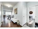 Spacious hallway with wooden floors and adjacent dining area at 14584 Hinton Dr, Fishers, IN 46037