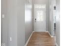 Bright foyer with hardwood flooring, a decorative front door, and neutral paint at 17023 Adler Ln, Noblesville, IN 46060