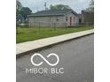 Cozy single-story home with a fenced yard and sidewalk access at 1710 S Birch St, Muncie, IN 47302