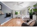 Bright living room with hardwood floors, a ceiling fan, and lots of natural light at 1715 Haynes Ave, Indianapolis, IN 46240