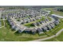 Wide aerial perspective of this home within the community that includes nearby ponds and playgrounds at 17344 Hanningfield Way, Westfield, IN 46074